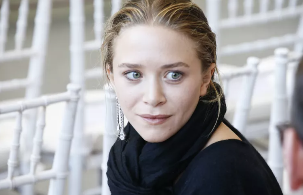 Mary-Kate Olsen’s Charming Red Trench Coat with Gold Metallic Loafers